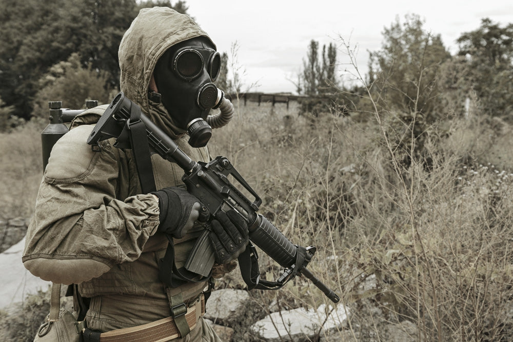Post Apocalypse Survivor in Gas Mask on City Ruins Poster Print by Oleg Zabielin