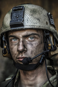 Close-up portrait of a young U.S. Army Ranger wearing a combat helmet.