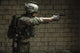 U.S. Army Ranger aiming a pistol - Poster Print by Oleg Zabielin.