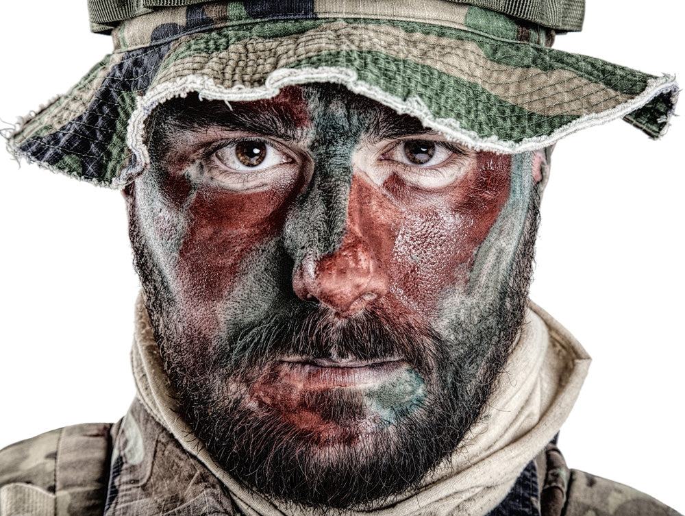U.S. Special Forces soldier poster print wearing jungle hat with face paint.