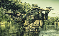 Pair of soldiers in action during a river raid in the jungle poster print by Oleg Zabielin