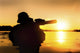 Silhouette of special forces soldier during a river raid in the jungle poster print
