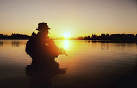 Silhouette of special forces soldier during a river raid in the jungle poster print.