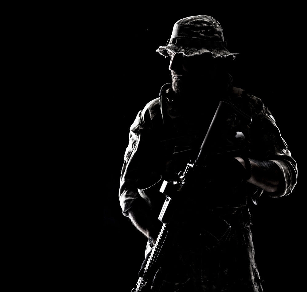 Bearded Special Forces soldier portrait in backlight, military art print.