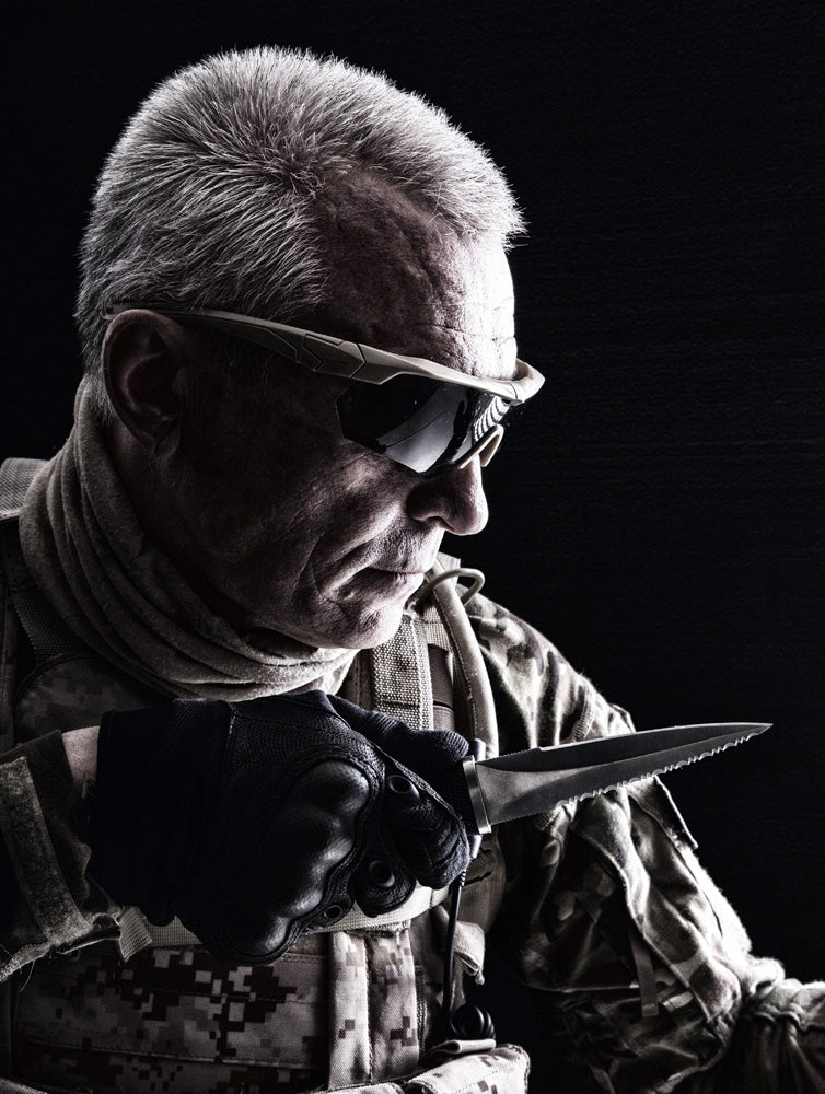 Close-up studio shot of special forces white-haired veteran with knife poster print.