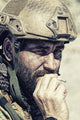 Close-up poster print of a soldier smoking in the desert by Oleg Zabielin.