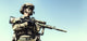 Low angle view of special forces soldier in field uniform with weapon poster print.