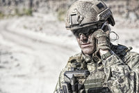 Close-up portrait of soldier on phone in desert, poster print by Oleg Zabielin