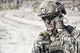 Close-up portrait of soldier on phone in desert, poster print by Oleg Zabielin