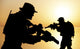 Silhouette of Army soldiers crossing a river at sunset poster print by Oleg Zabielin.