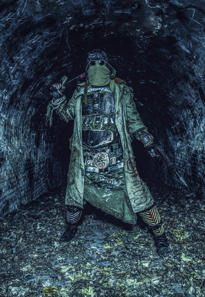 Post apocalyptic survivor holding pistol and machete in abandoned tunnel poster print by Oleg Zabielin.