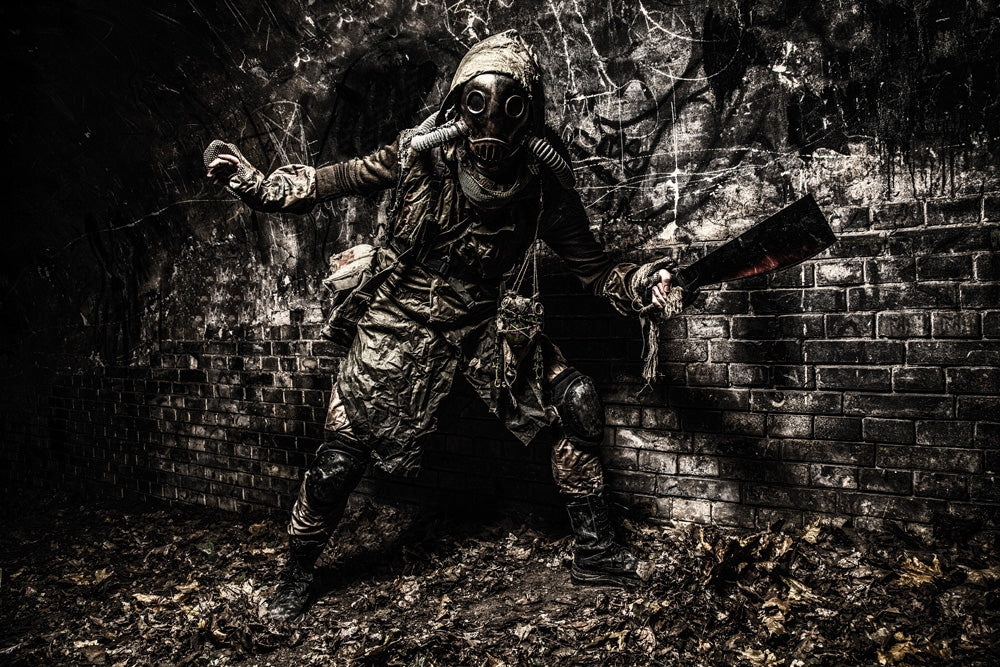 Mutant creature in gas mask emerging from darkness in an abandoned tunnel poster print.