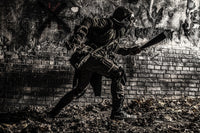 Post Apocalyptic Survivor Running Along Graffiti Wall Poster Print