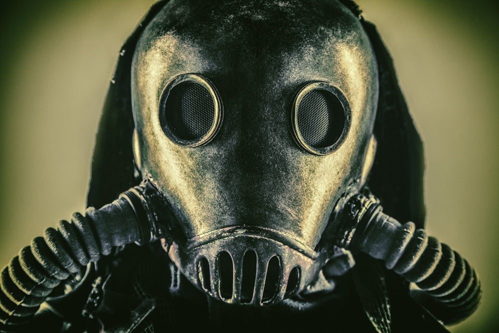 Close-up portrait of a post-apocalypse survivor wearing a gas mask.