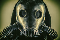 Close-up portrait of a post-apocalypse survivor wearing a gas mask.