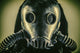 Close-up portrait of a post-apocalypse survivor wearing a gas mask.