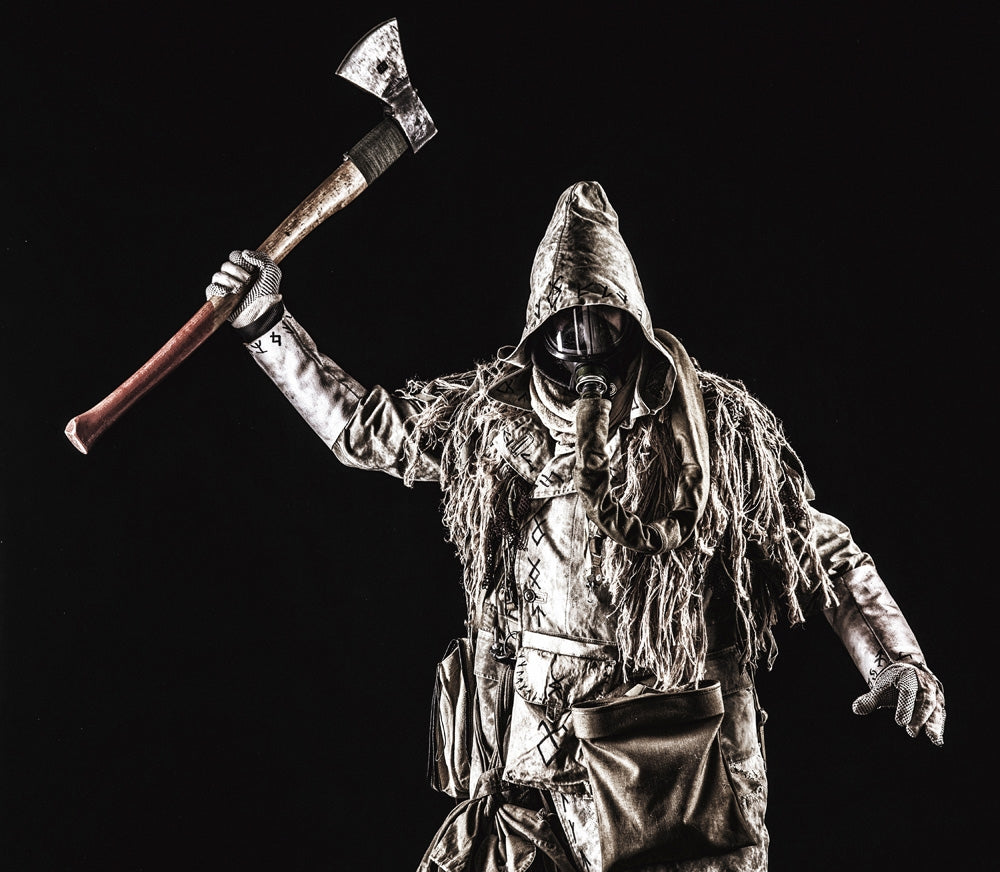 Post-apocalyptic survivor wearing a gas mask and holding an axe poster print by Oleg Zabielin.