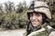 Portrait of a smiling Army soldier in battle helmet poster print by Oleg Zabielin.