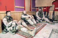 U.S. Marines sitting and talking at their combat outpost - Poster Print by Oleg Zabielin