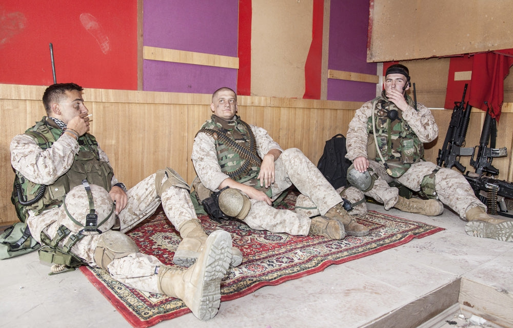 U.S. Marines resting at combat outpost poster print by Oleg Zabielin