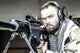 U.S. Navy SEAL Sniper Poster Print featuring a sniper in firing position with a large caliber sniper rifle.