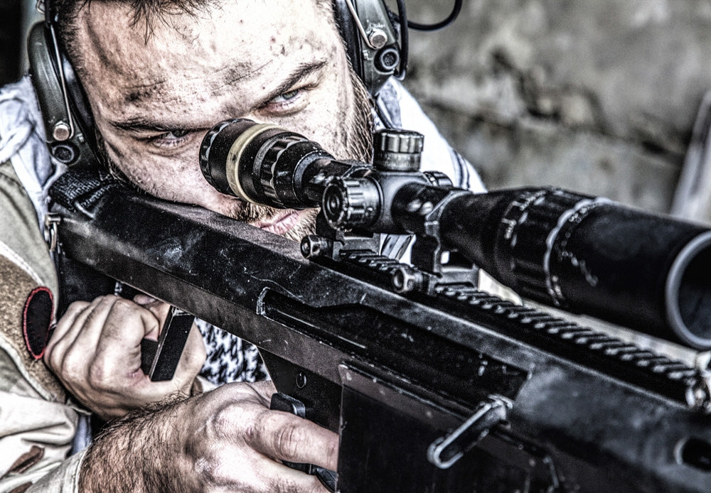 U.S. Navy SEAL sniper in firing position with large caliber rifle poster print.