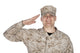 Studio portrait of smiling soldier giving hand salute poster print