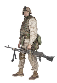 Soldier in camouflage combat uniform with a machine gun poster print.