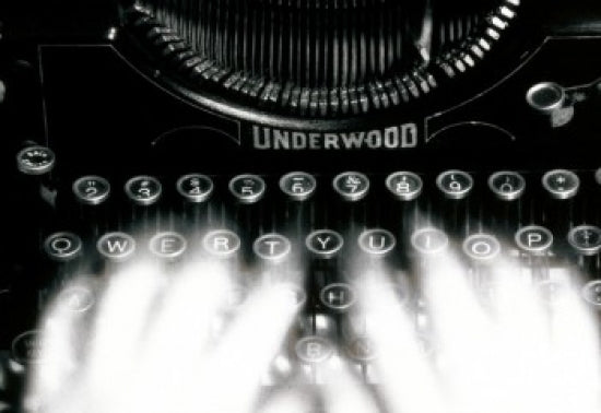Close-up of a person's hands typing on a typewriter poster print