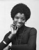 Portrait of a young woman smiling Poster Print