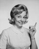 Portrait of a young woman pointing upwards poster print.