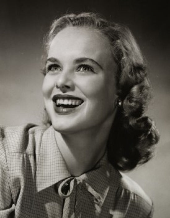 Close-up poster print of a young woman smiling, perfect for home decor.