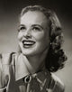Close-up poster print of a young woman smiling, perfect for home decor.