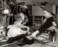 Side Profile of a Girl and Her Brother Playing with a Toy Train Poster Print