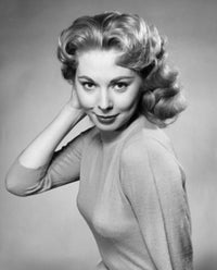 Portrait of a young woman with her hand in her hair poster print