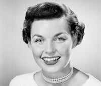 Portrait of a young woman smiling poster print, available in various sizes.