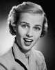 Portrait of a Young Woman Smiling Poster Print showcasing warmth and positivity.