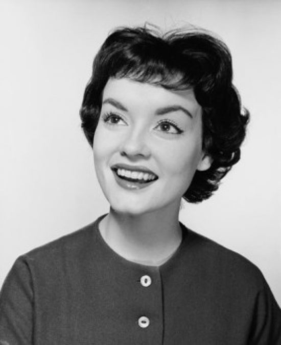 Close-up portrait of a smiling young woman poster print.