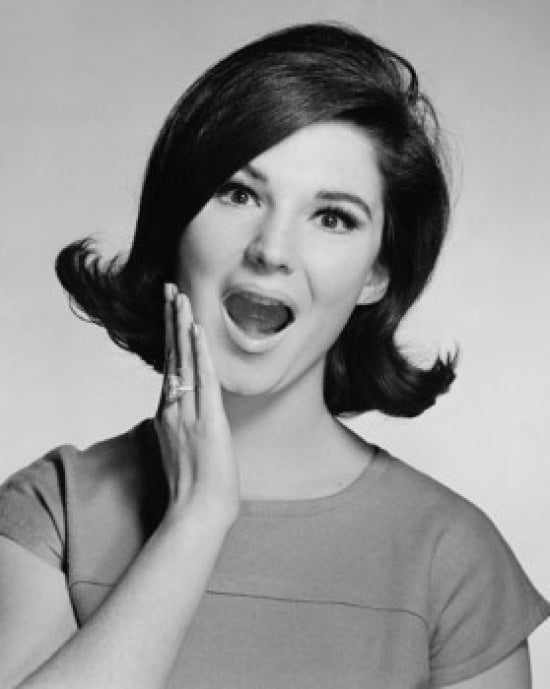 Portrait of a young woman looking surprised poster print