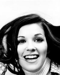 Close-up poster print of a young woman smiling, showcasing joy and positivity.