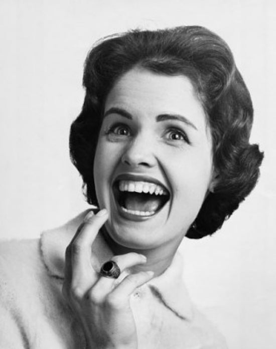 Close-up poster print of a young woman laughing, vibrant and joyful.