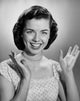 Studio portrait of a young woman smiling poster print.