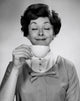Portrait of a young woman enjoying a cup of tea poster print.