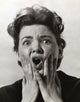 Portrait of a mid adult woman looking alarmed poster print