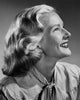 Close-up of a young woman smiling poster print