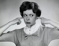 Portrait of a young woman with fingers in ears - Poster Print