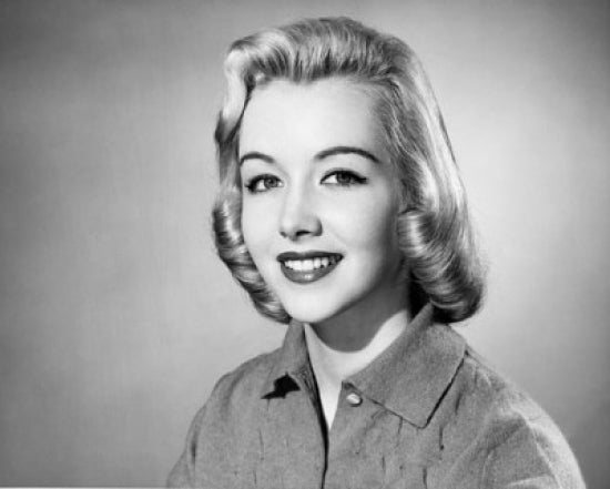 Portrait of a young woman smiling poster print.