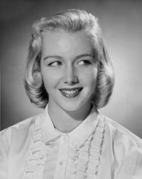 Close-up poster print of a young woman smiling, showcasing joy and positivity.