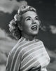Close-up poster print of a young woman smiling, showcasing her joyful expression.