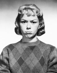Portrait of a young woman making a face poster print.